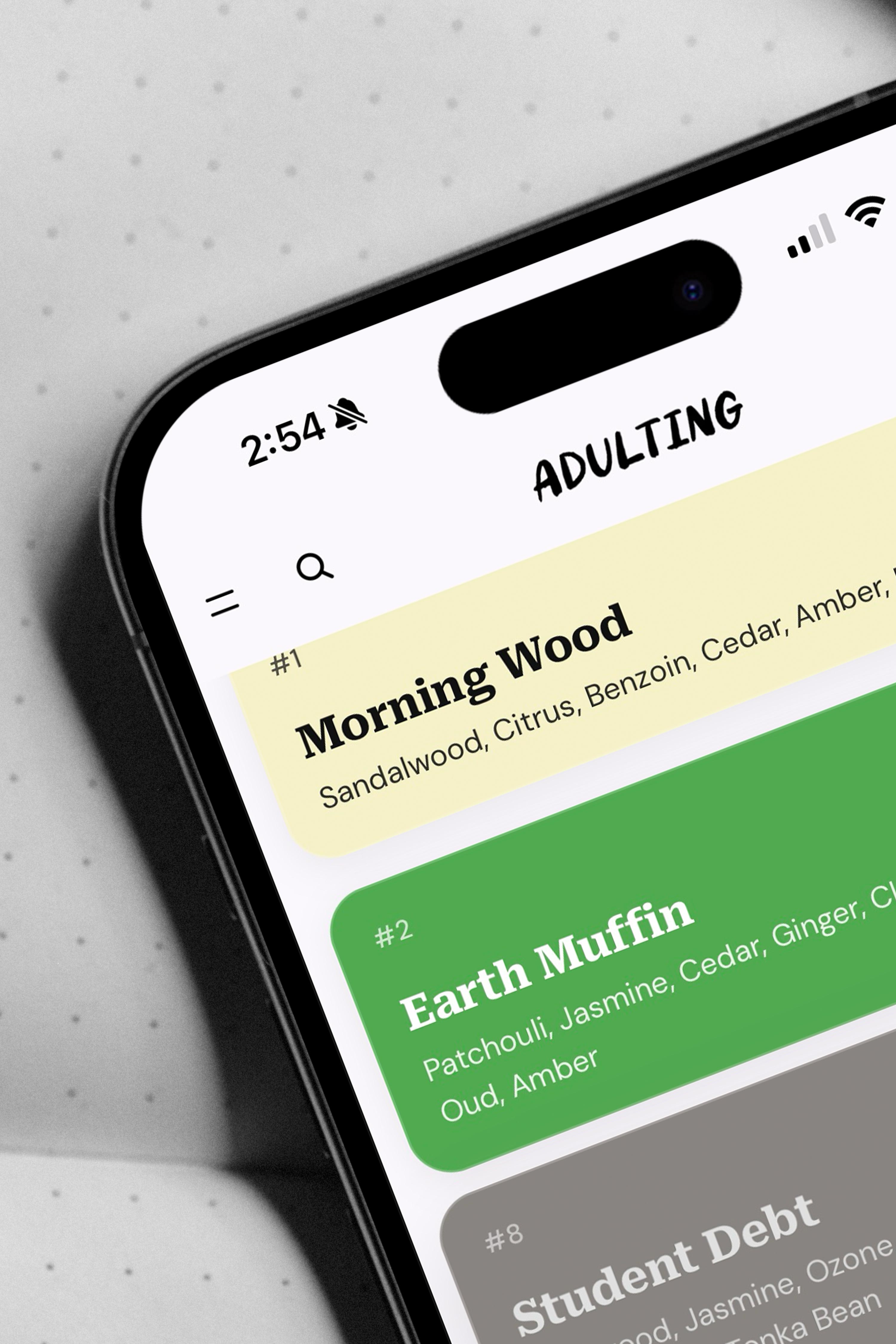 Adulting Candle Co. fragrance library CMS on a phone